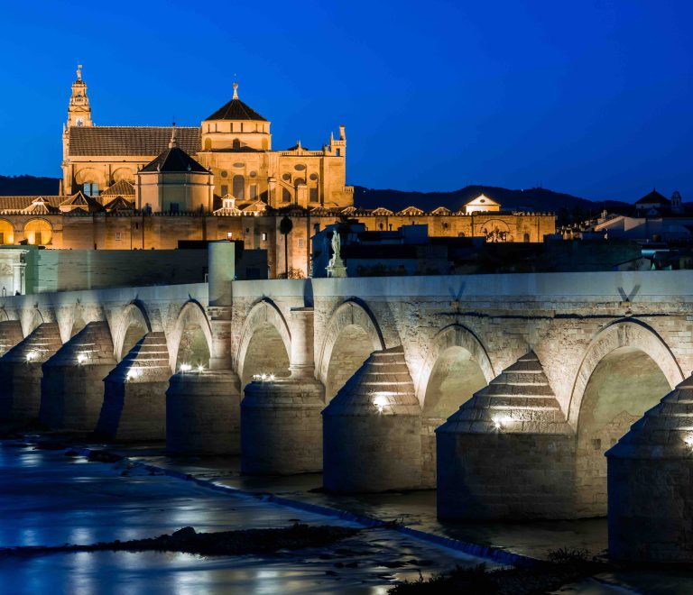 Cityscape of Cordoba at sunset with roman bridge and Mezquita, Andalusia, Spain